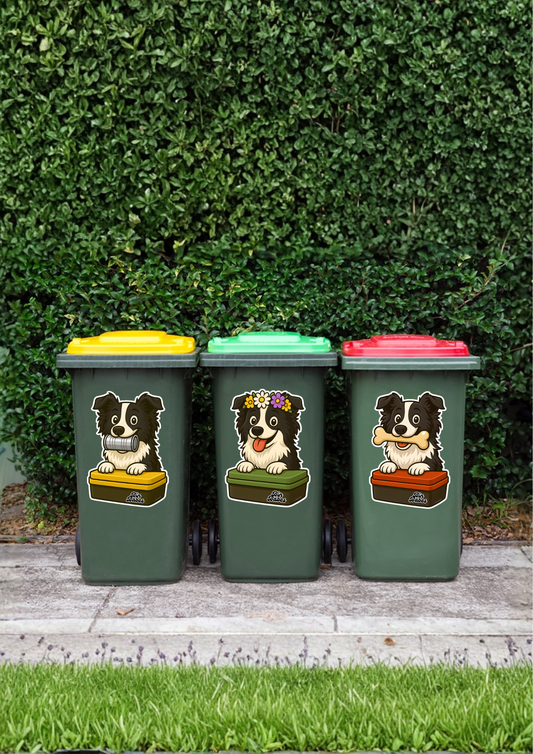 Three wheelie bins with dog stickers on a grassy background.