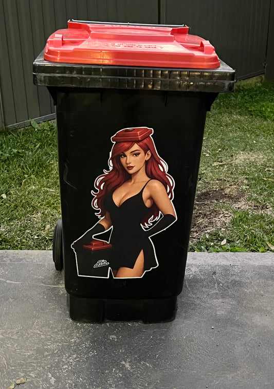 Black trash bin with a graphic design of a woman on a grassy area.